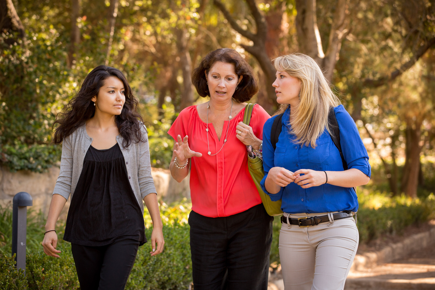 Professor talking with two students