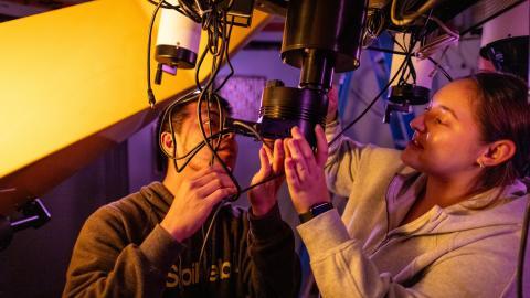 Astrophysics Minor students checking wires